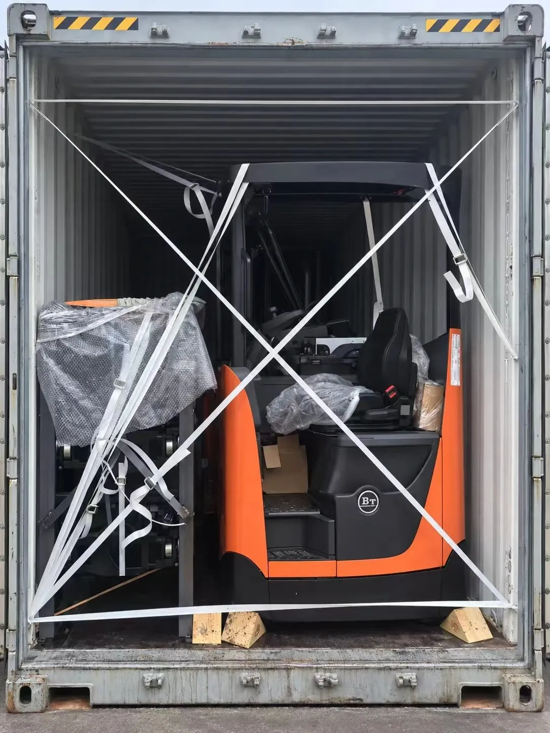 LOAD SECURING, Forklift and attachments secured in place.